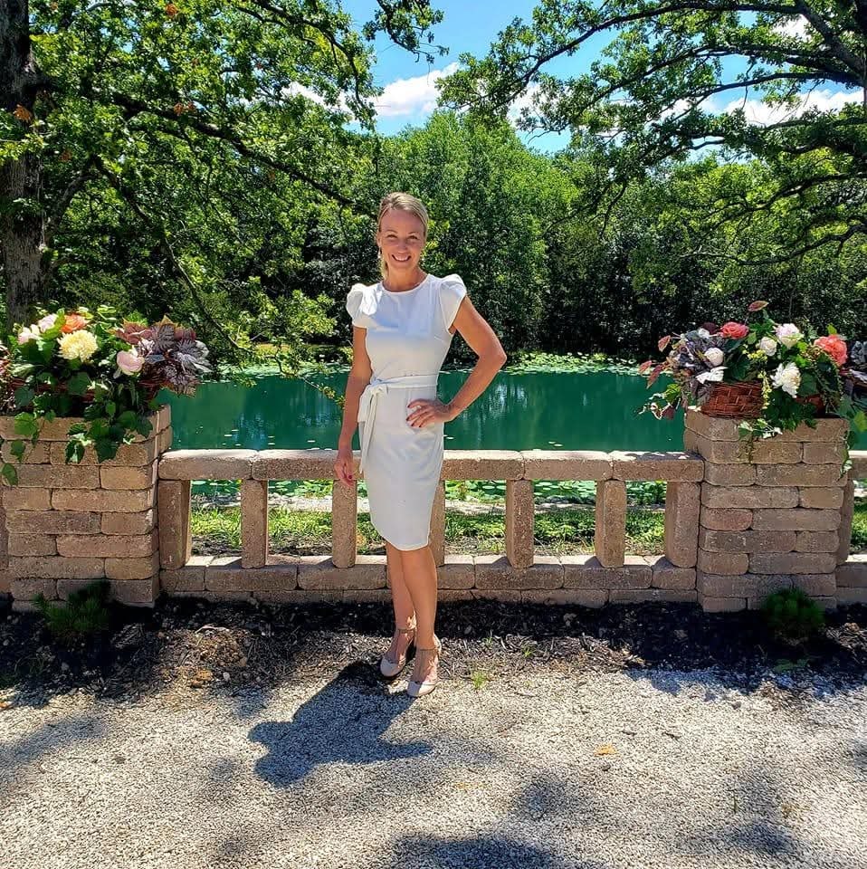 Owner of Satins and Sashes in a garden setting