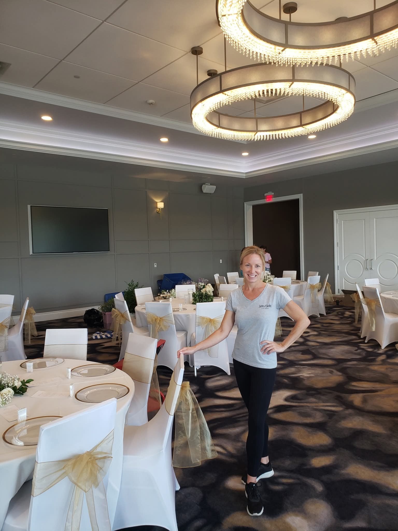 Owner setting up linens at an event venue