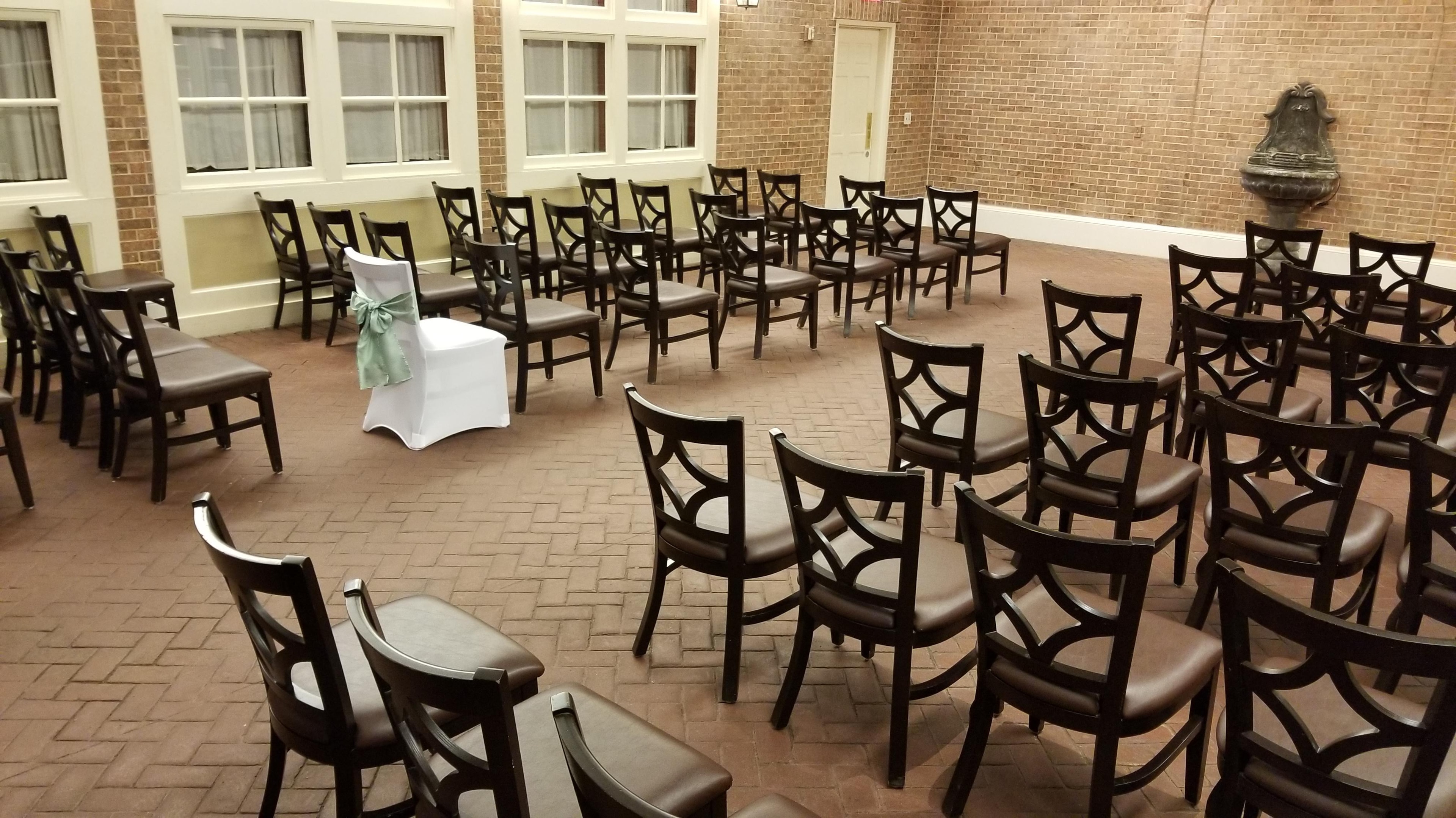 Intimate ceremony setup in a charming brick venue