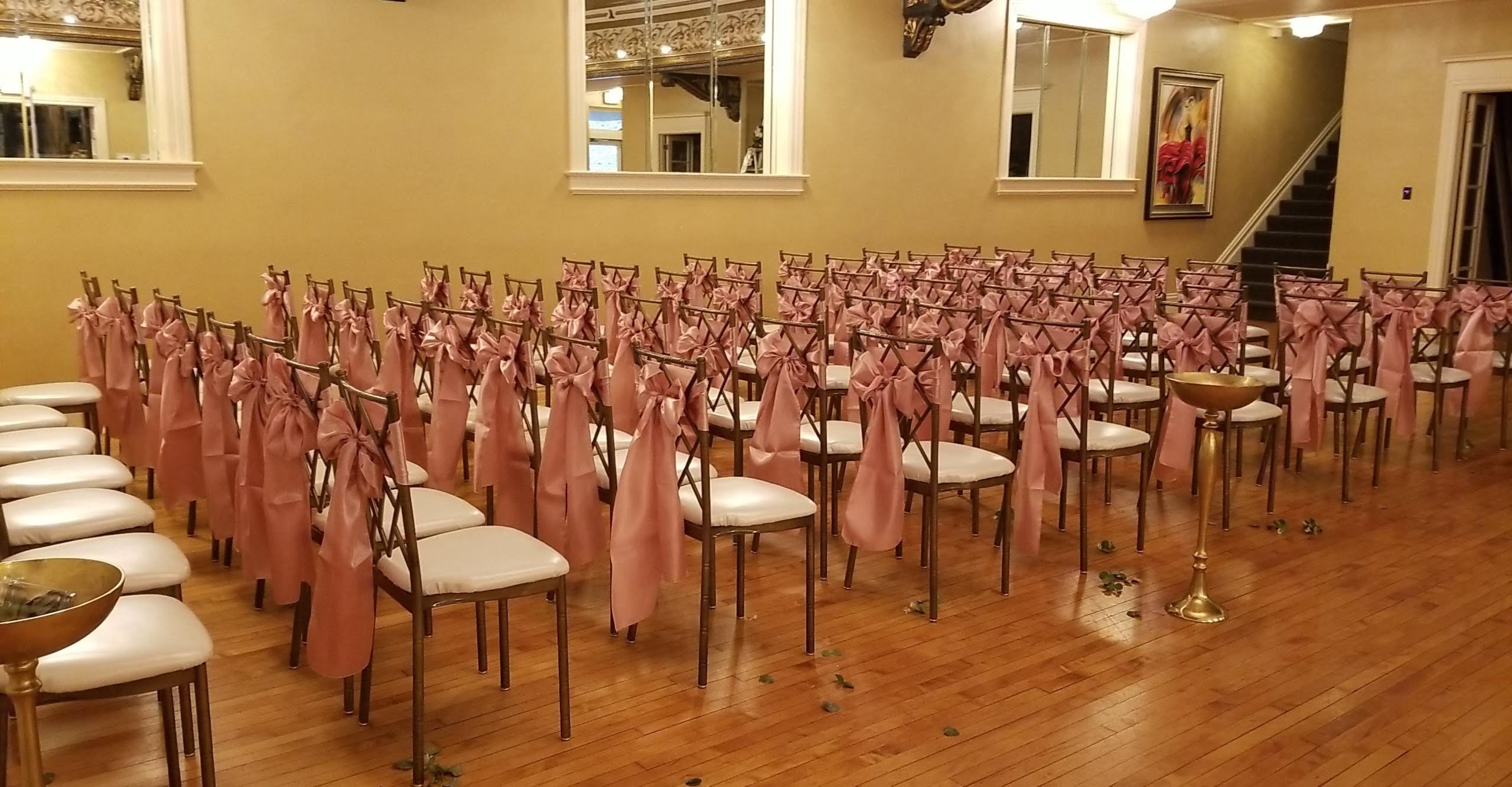 Full round table setup with periwinkle tablecloth and matching sashes